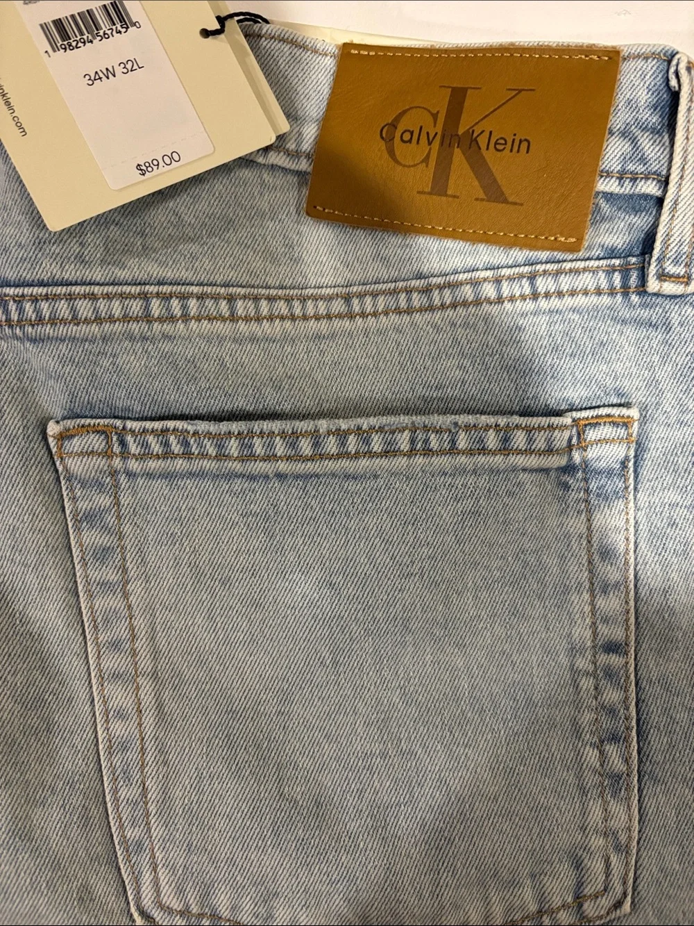 Calvin Klein Light Wash Denim Jeans with Tan Leather Patch - Picture 1 of 10